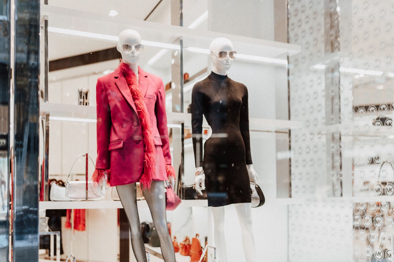 hero-img-02 Stylish mannequins in a fashion store window showcasing modern attire. Perfect for shopping inspiration.
